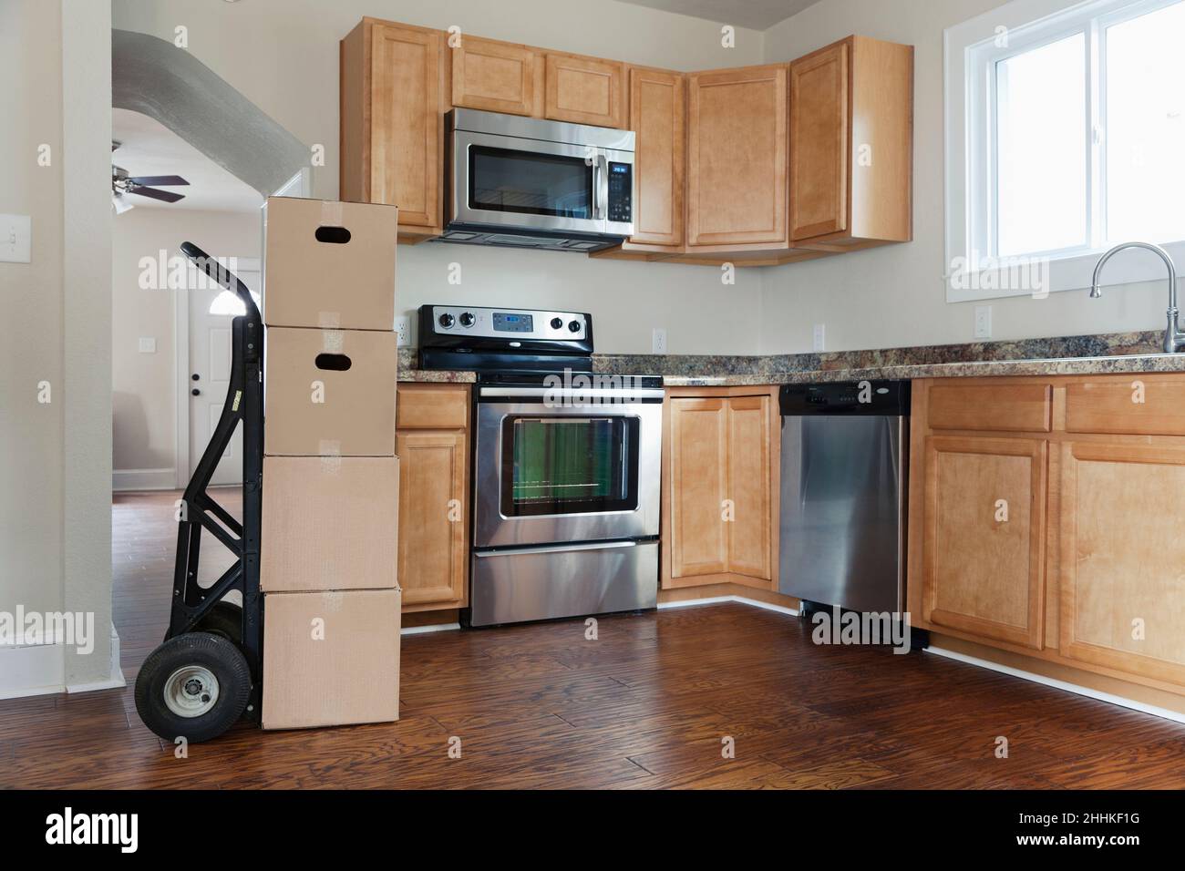Moving boxes in kitchen Stock Photo - Alamy