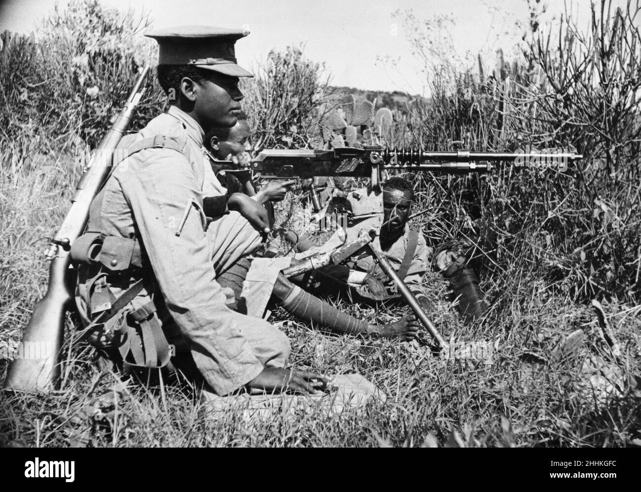 Abyssinian War September 1935Abyssinian machine gunner firing an old Hotchkiss machine gun on the Ogadan front during the Italian invasion of Abyssinia. Stock Photo