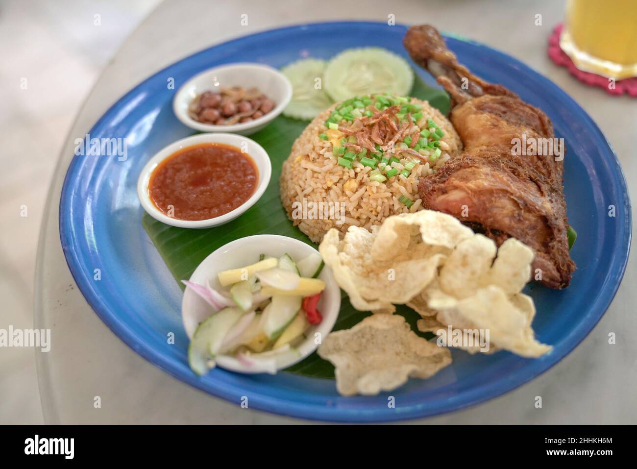 Fried rice with fried chicken, preserved pickles, chilly sauce