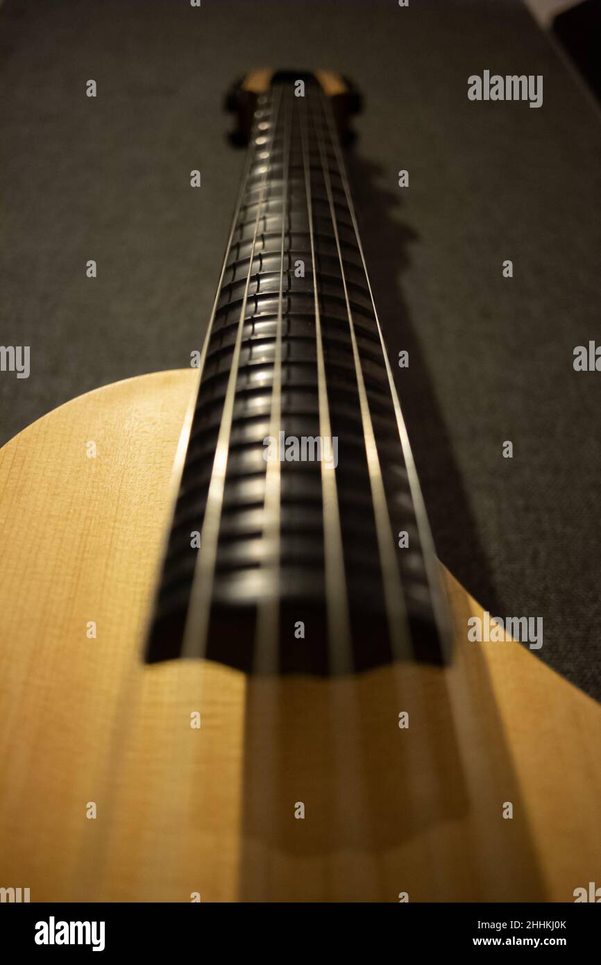 Antique Asian music instrument, pipa, hung in wall in a music studio Stock Photo