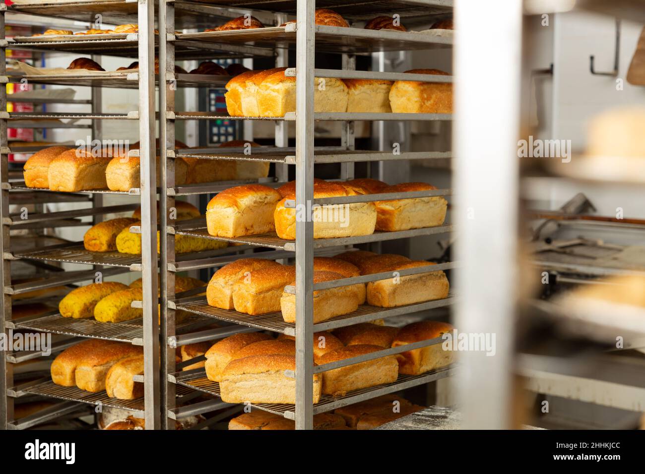 Freshly baked bread on trolley in bakery Stock Photo