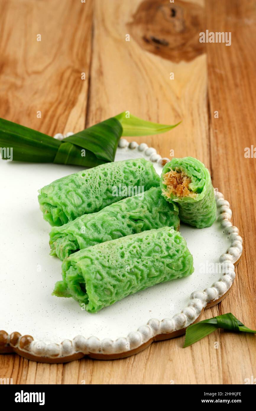 Dadar Gulung, Traditional Indonesian Malaysian Crepes Snack Made from Glutinous Rice, Grated Coconut, and Palm Sugar. Popular in Malaysia, Indonesia, Stock Photo