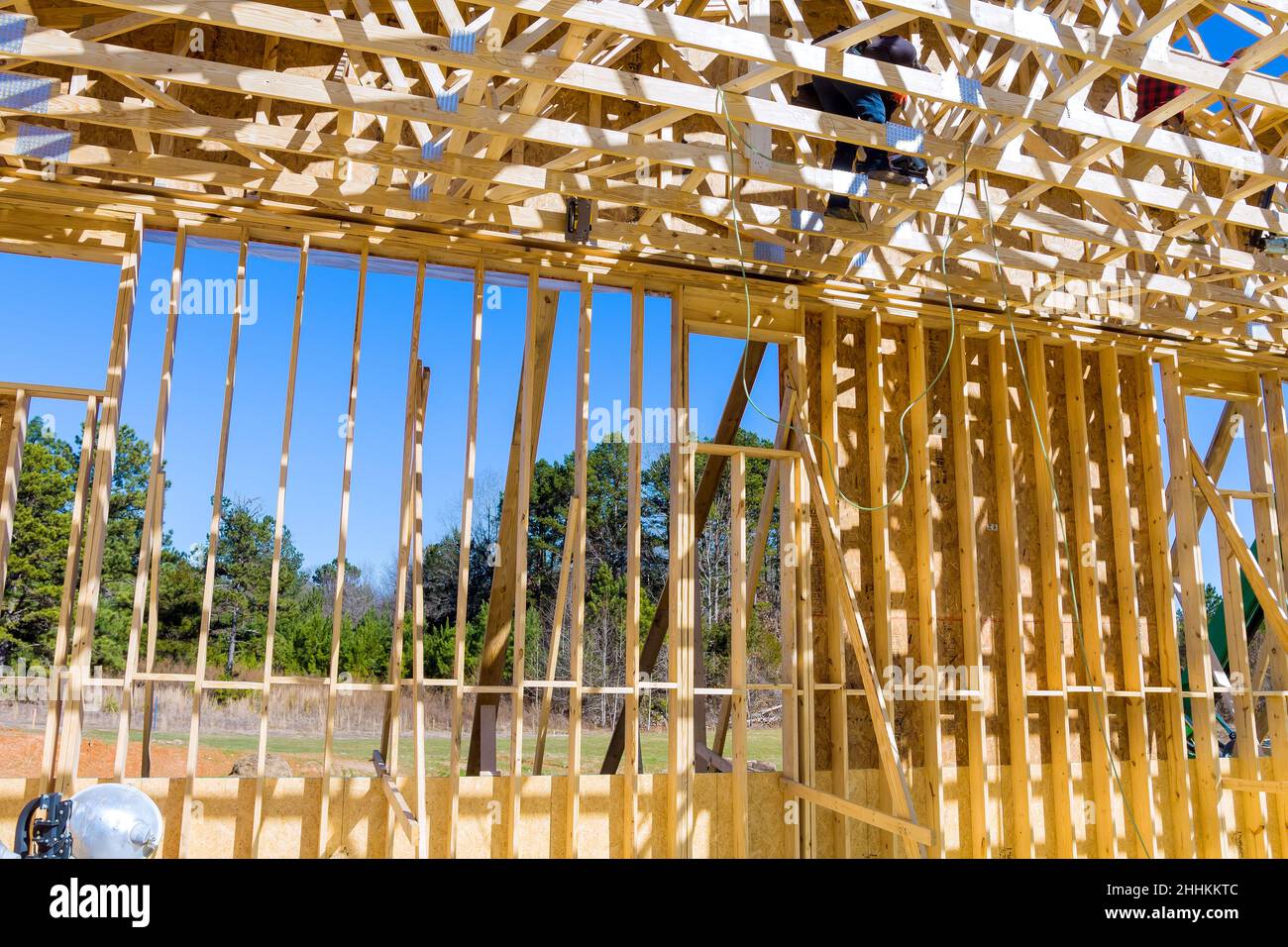 Construction team, new building construction with roof carpentry works