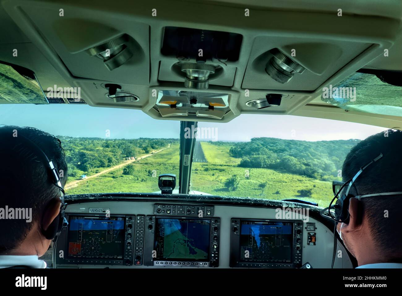 Pilots navigating a small Cessna leaving Big Corn Island, Nicaragua Stock Photo
