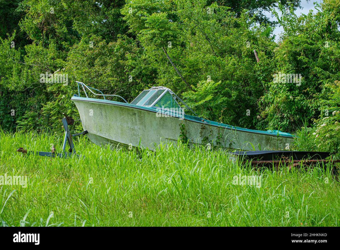 Abandoned Boat and Trailer in Wooded Urban Area of New Orleans, LA, USA