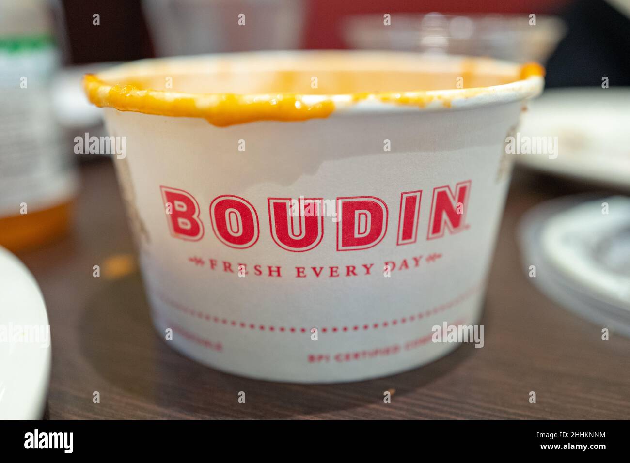 Closeup of logo for Boudin on takeout container of tomato soup, Walnut
