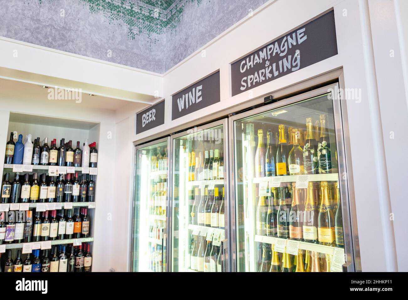 Retail display featuring chilled white wines, champagne and sparking