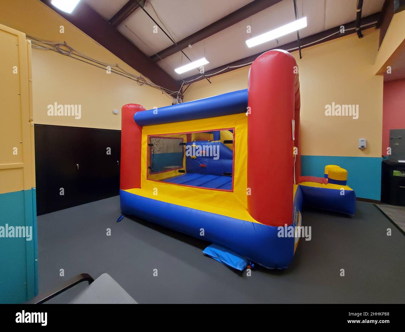 Bounce house is visible at Swings and Wings indoor play space on