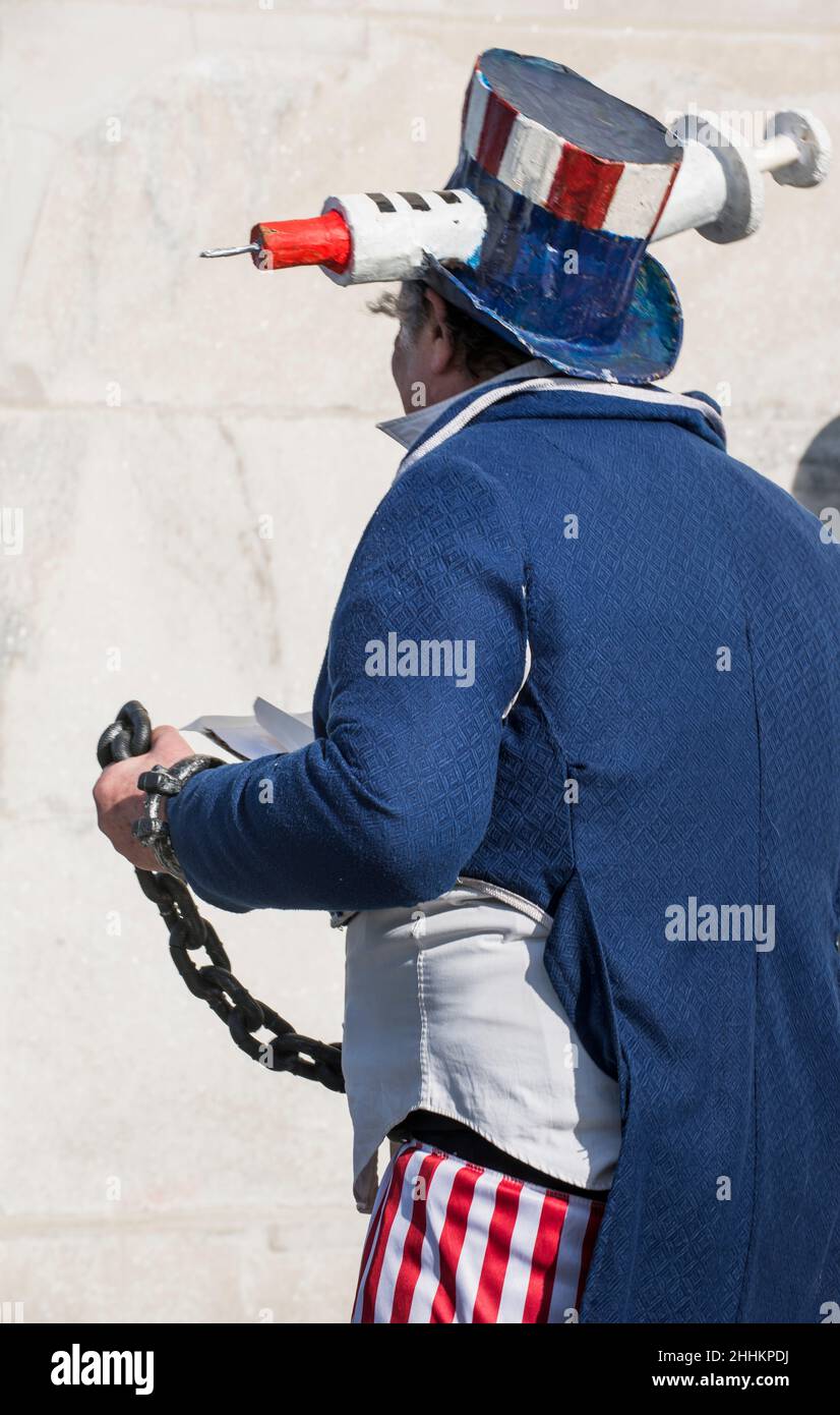 Protestor wearing Uncle Sam custom participates in Defeat the Mandates march in Washington, DC, on January 23, 2022, protesting COVID-19 mandates. Stock Photo