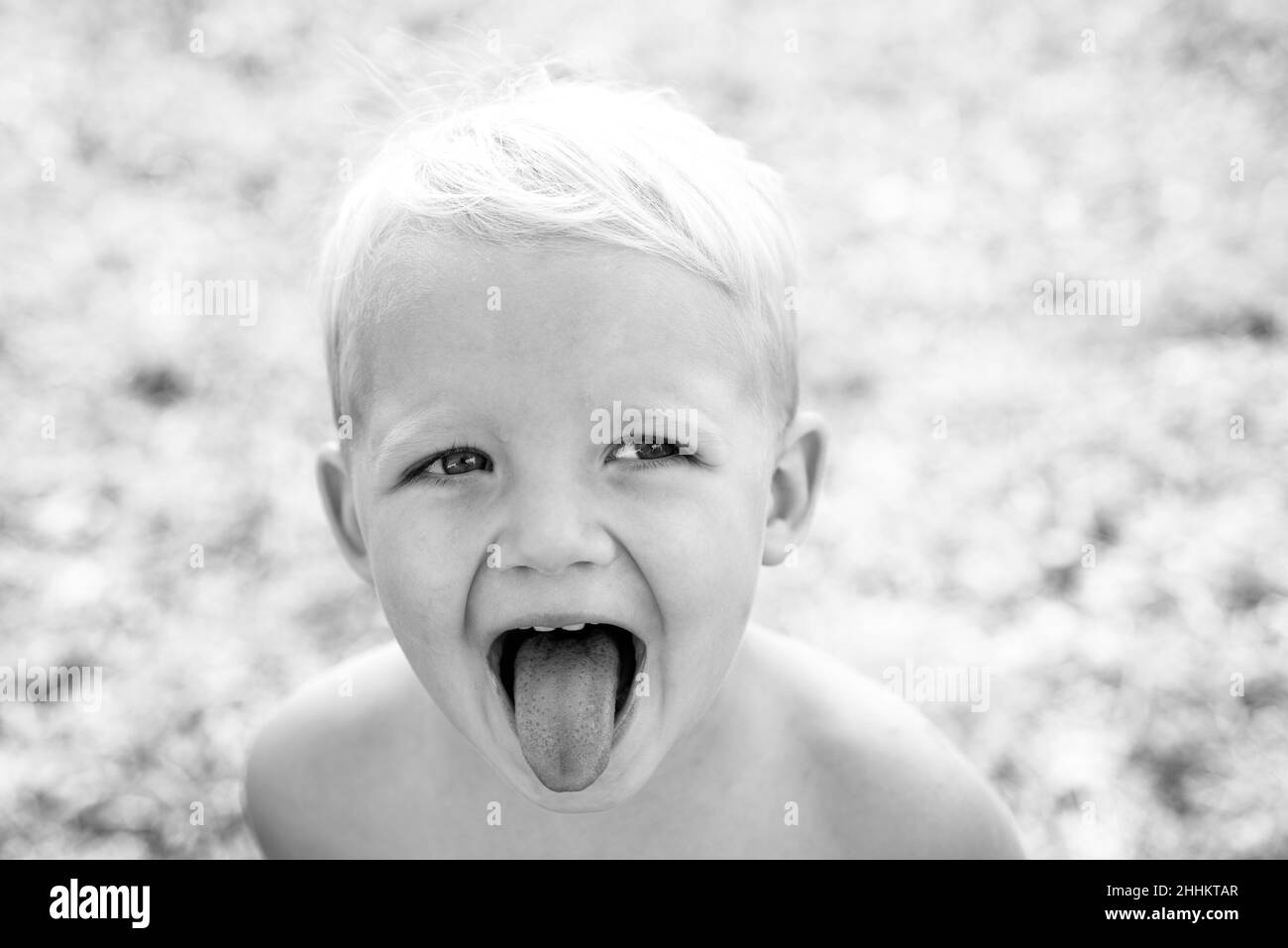 Only fun is on my mind. Child outdoors in nature. Has happy. Funny little boy. Stock Photo