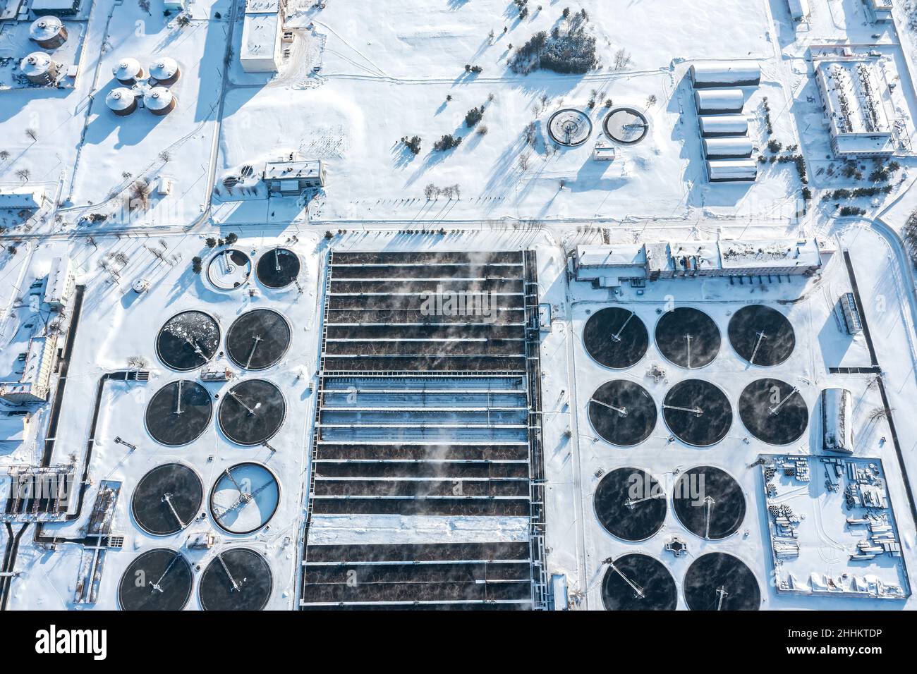 modern urban sewage water treatment plant. aerial view in winter cold sunny day. Stock Photo