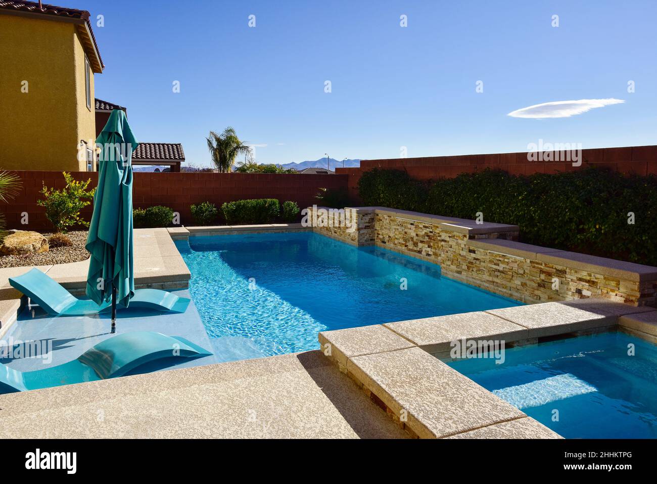 Desert southwest backyard pool and living space. Stock Photo