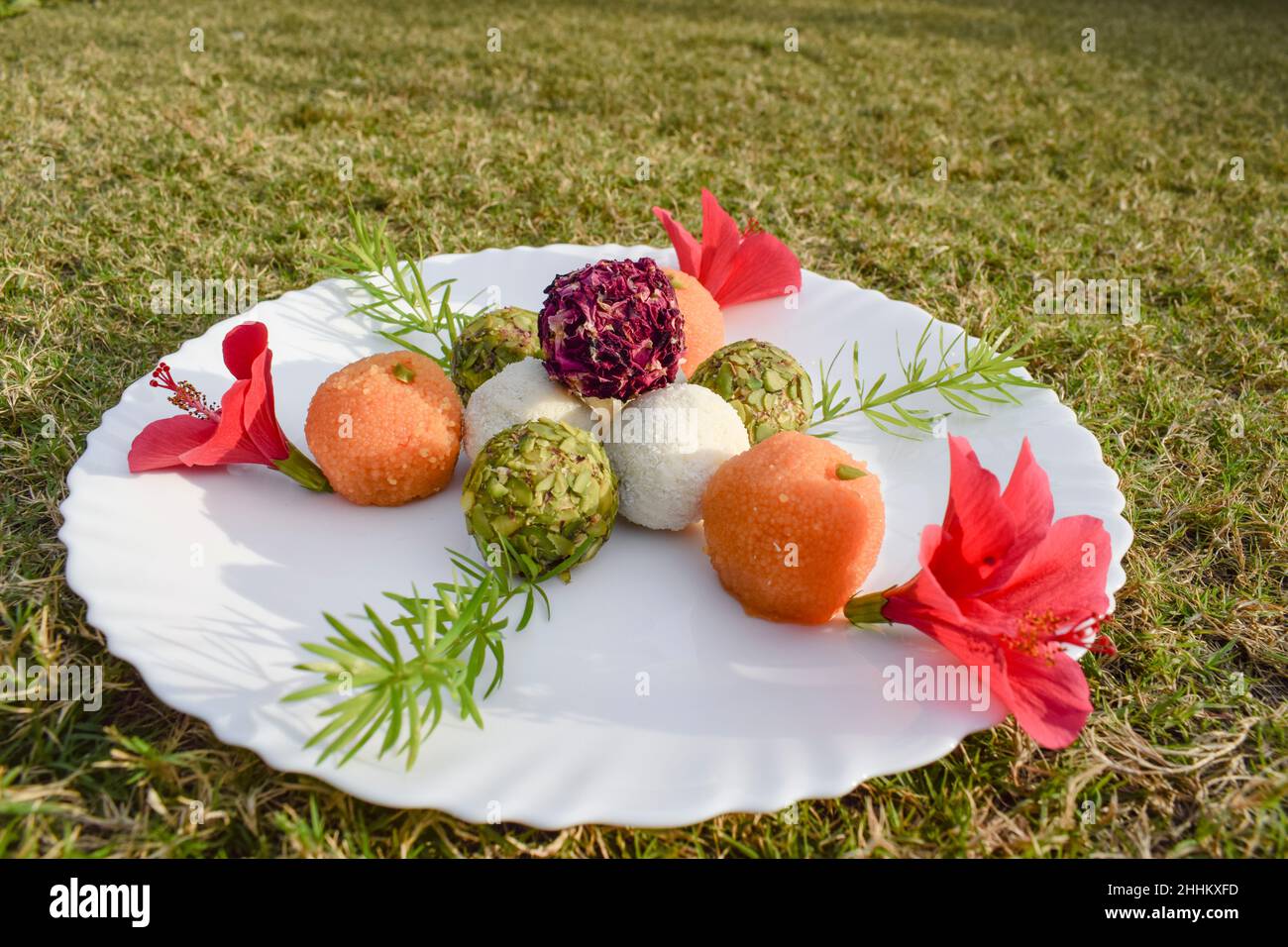 Tasty India flag tricolor Laddu or Ladoo sweet dish item for festive Republic day or India independence day celebration at home. Picnic food with tryp Stock Photo