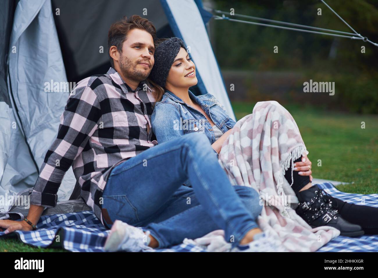 Young nice couple having fun on camping Stock Photo