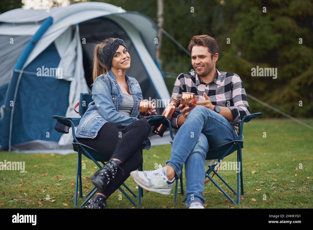 Couple sitting on camping chairs hi-res stock photography and images ...