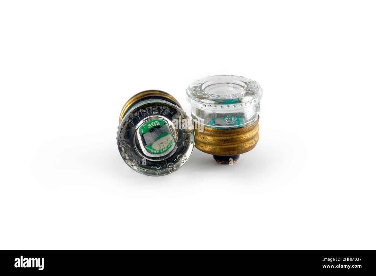 A pair of Edison base, 30A pyrex glass plug fuses isolated on a white background. cutout image for editorial and illustration use. Stock Photo
