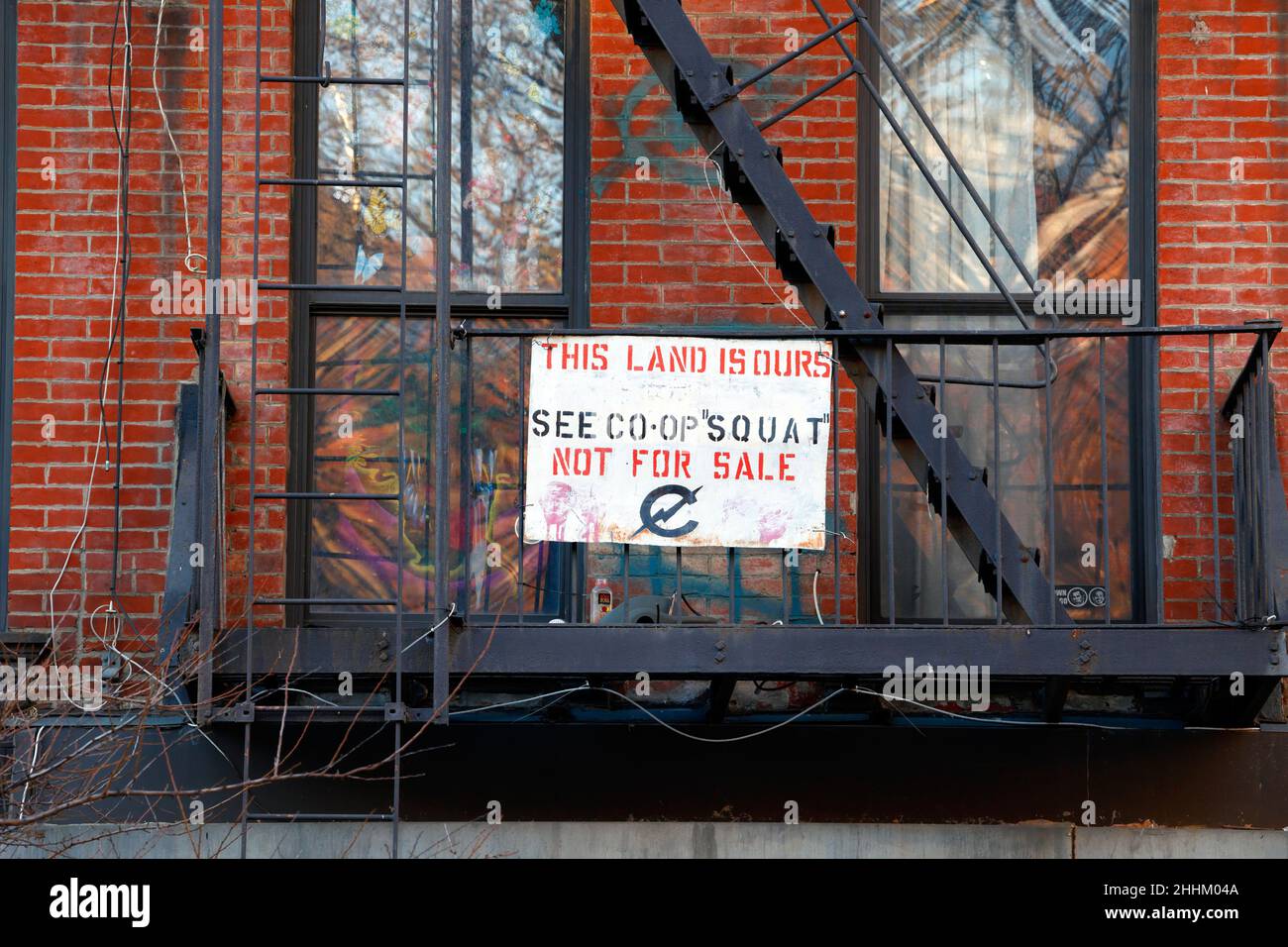 C-Squat, 155 Avenue C, New York, NY. a sign declares, 'This Land Is Ours, Not For Sale'. An old punk rock squat, and apartment co-op in Manhattan. Stock Photo
