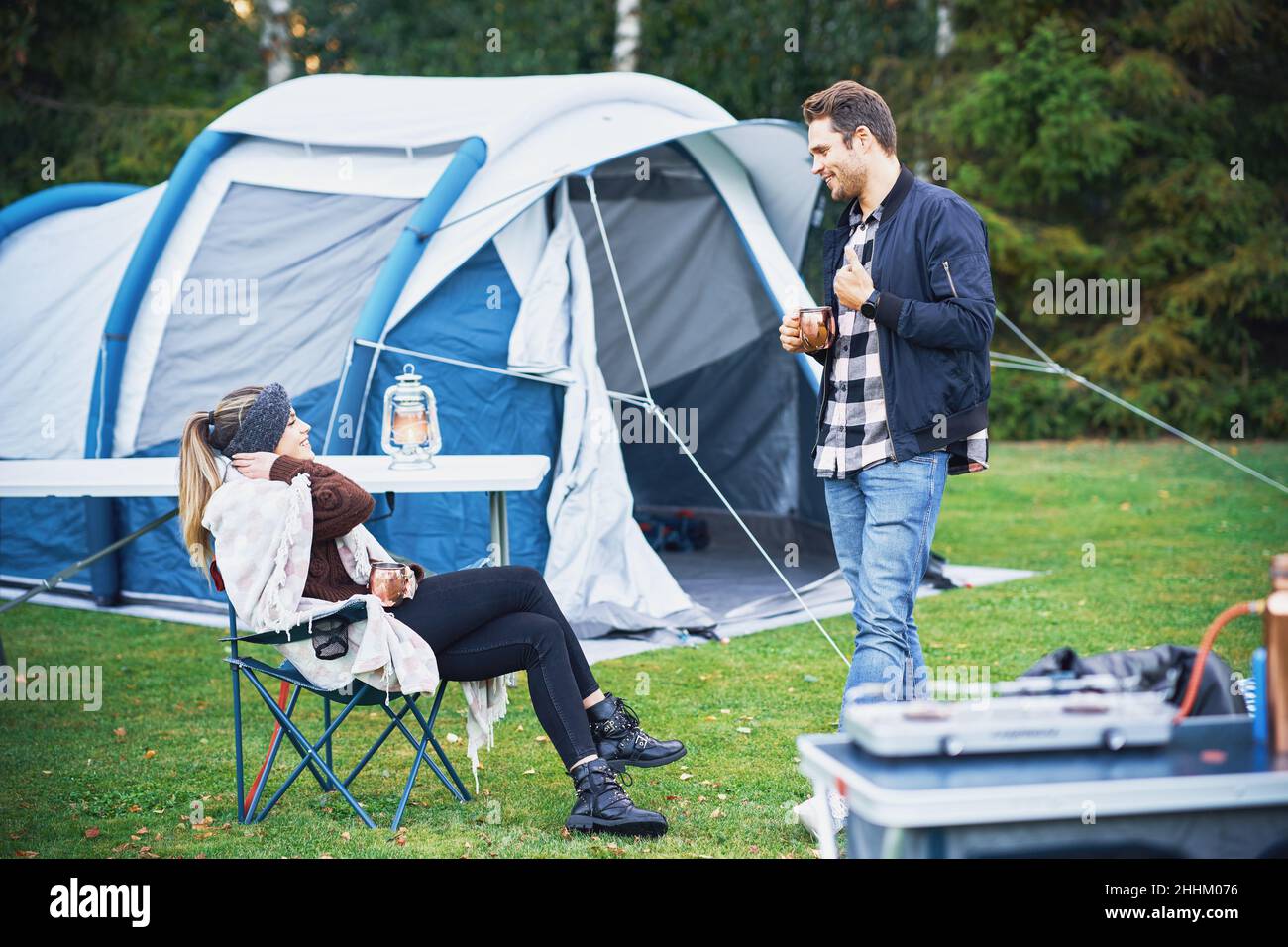 Young nice couple having fun on camping Stock Photo