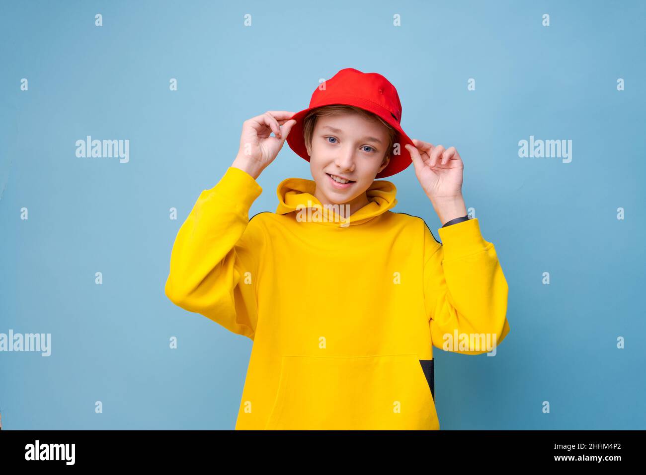 Rapper. City style. Model shooting. Happy hipster guy in yellow ...