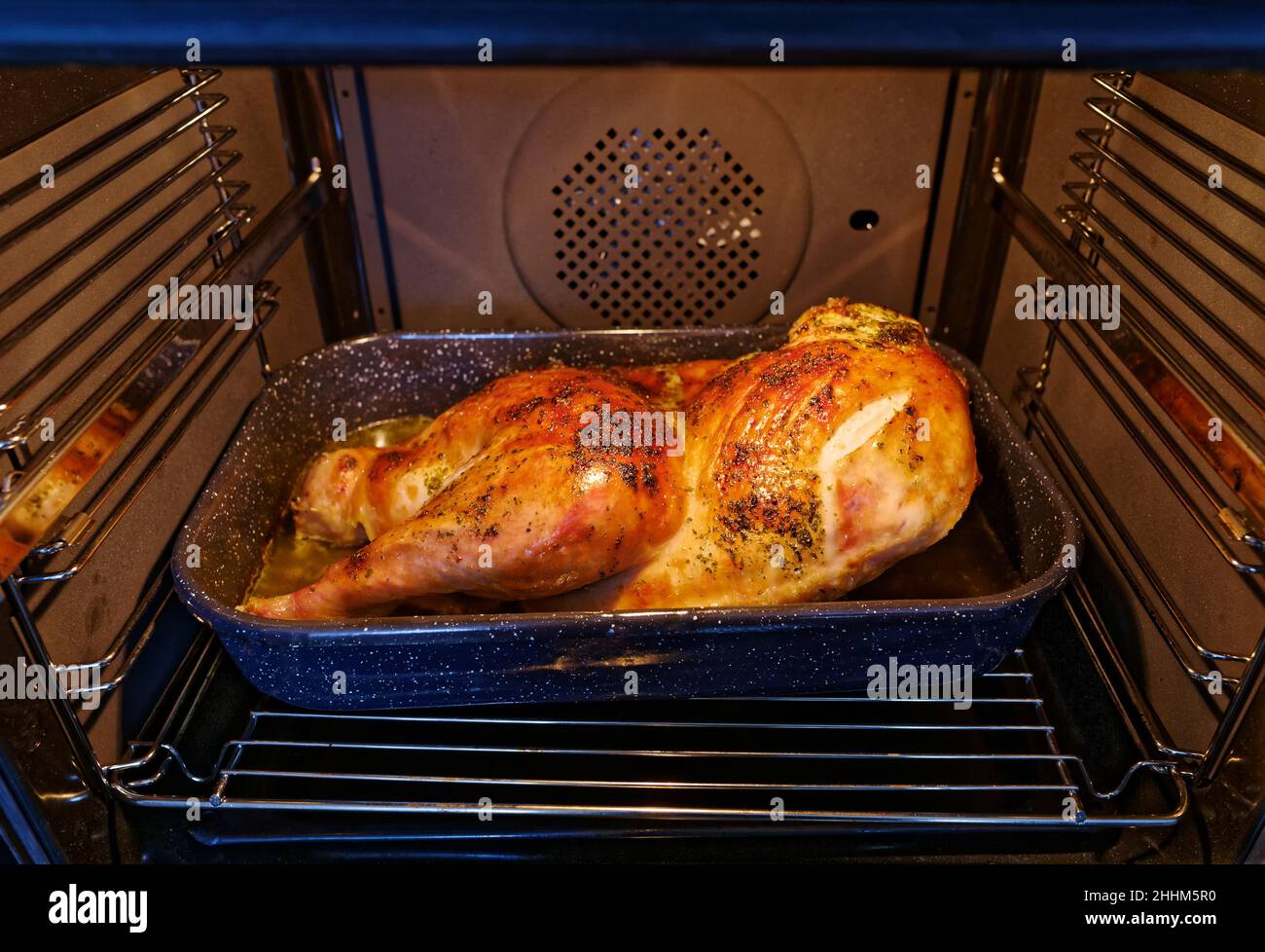 Roasted turkey in oven. Thanksgiving dinner Stock Photo Alamy