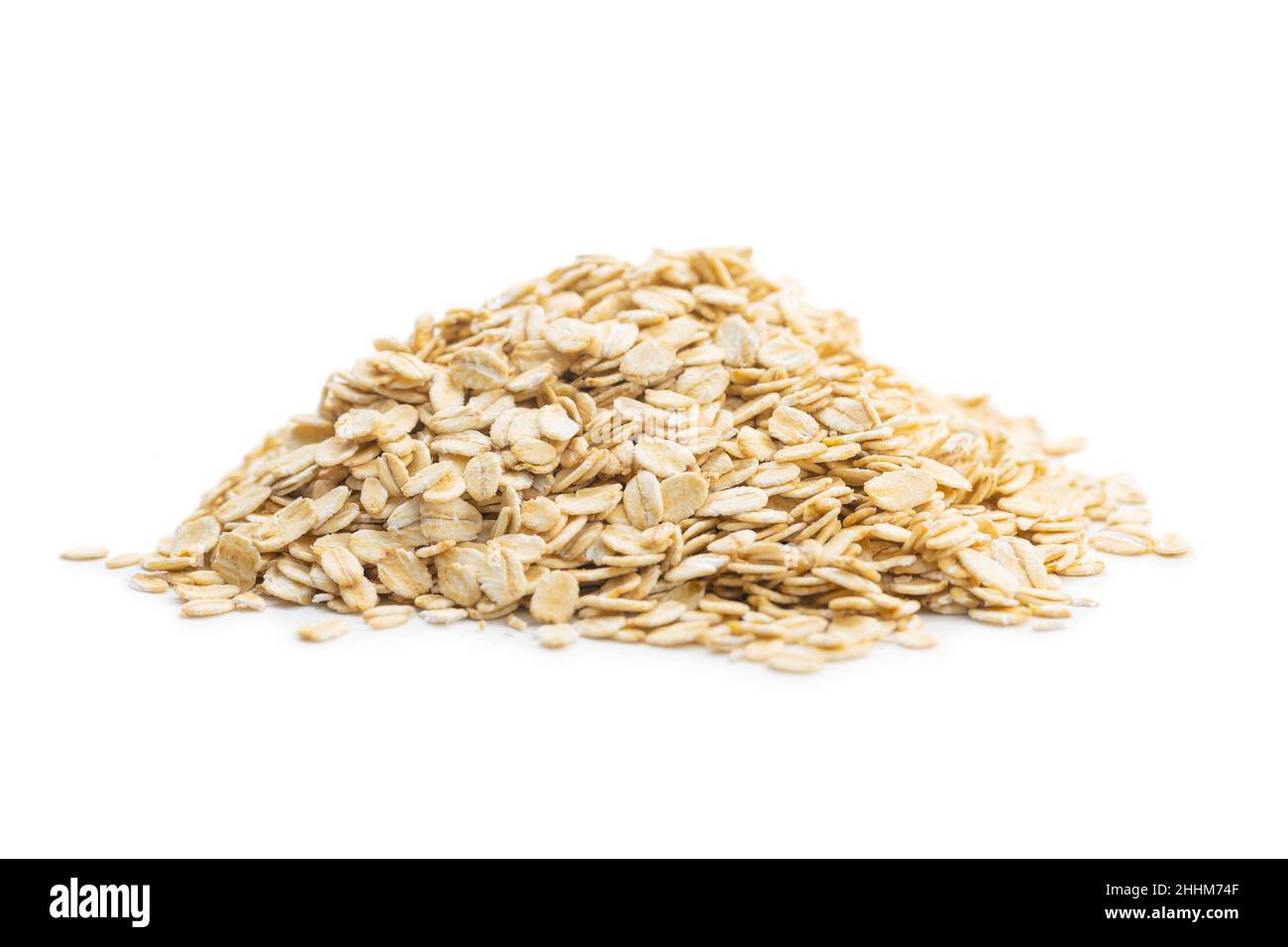 Breakfast cereals. Uncooked oatmeal. Raw oat flakes isolated on white background. Stock Photo