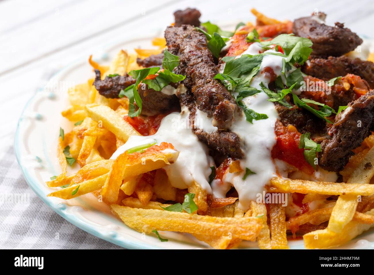 Turkish food; Cokertme Kebab Beef meat kebab with yoghurt and french