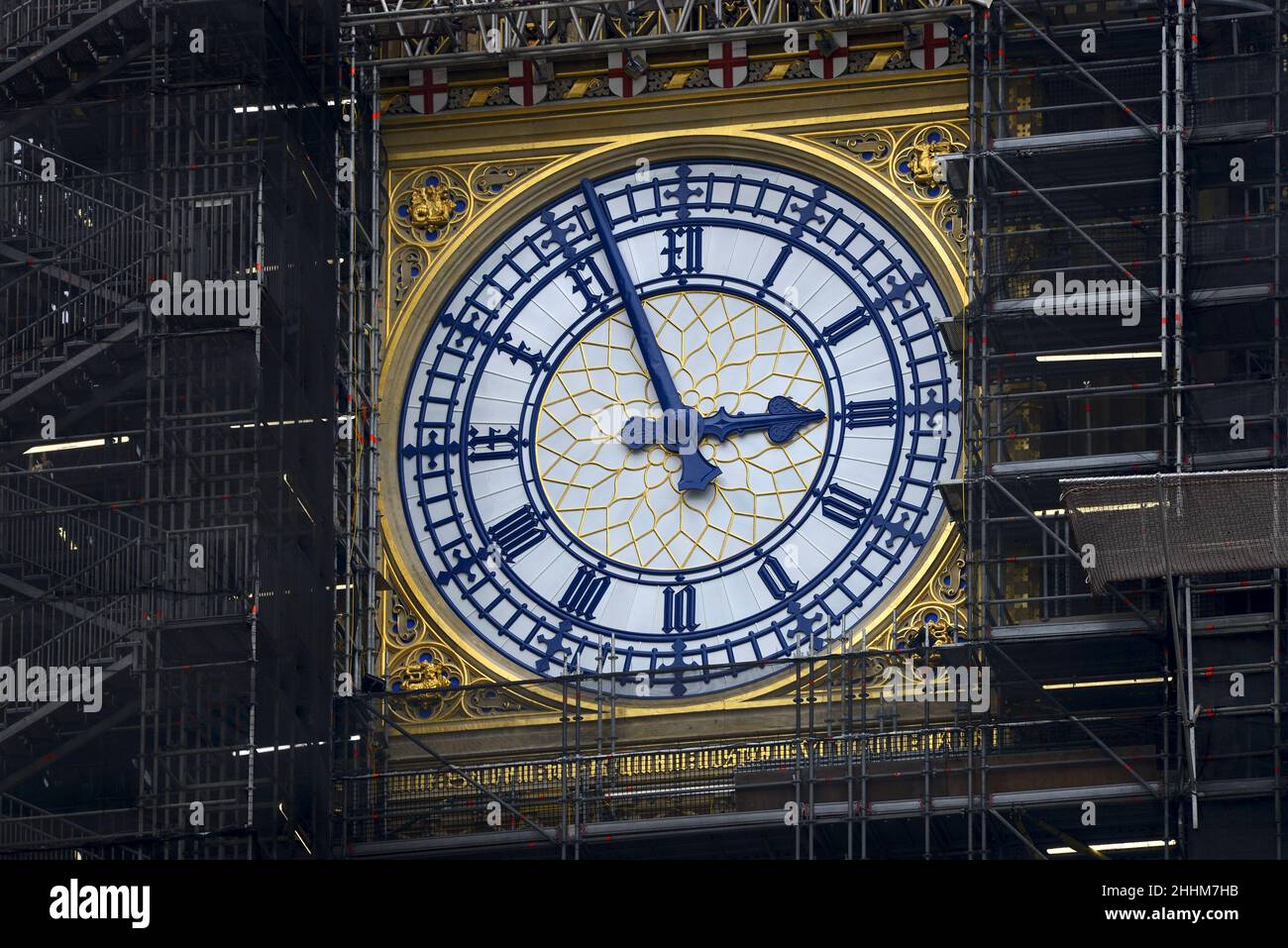 London, England, UK. One face of Big Ben revealed as the scaffolding is slowly removed after years of renovation work. Stock Photo