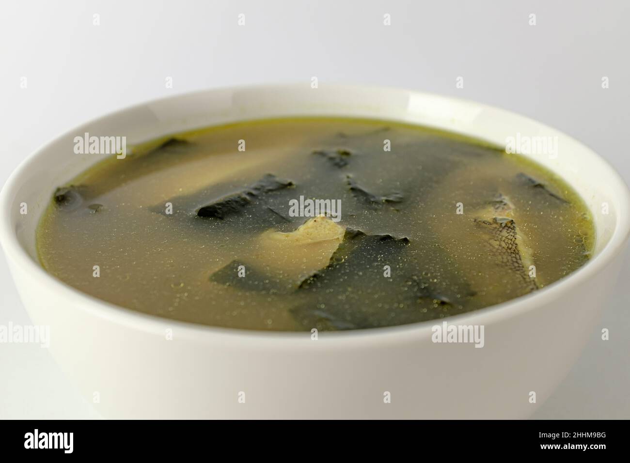 Broth dish with flounder. Dishes with seafood and seaweed. Korean food