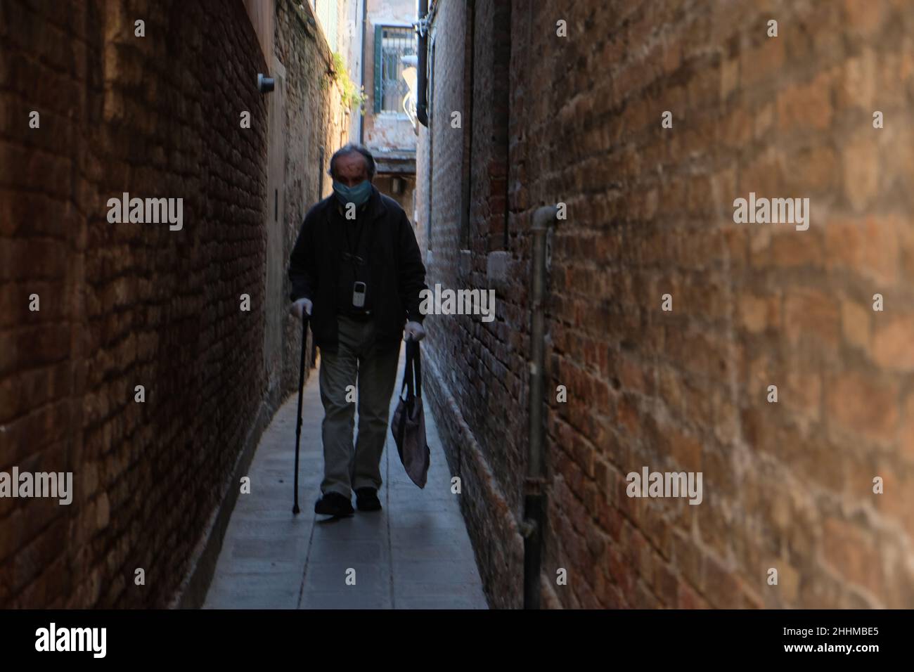 Old woman walks hi-res stock photography and images - Alamy