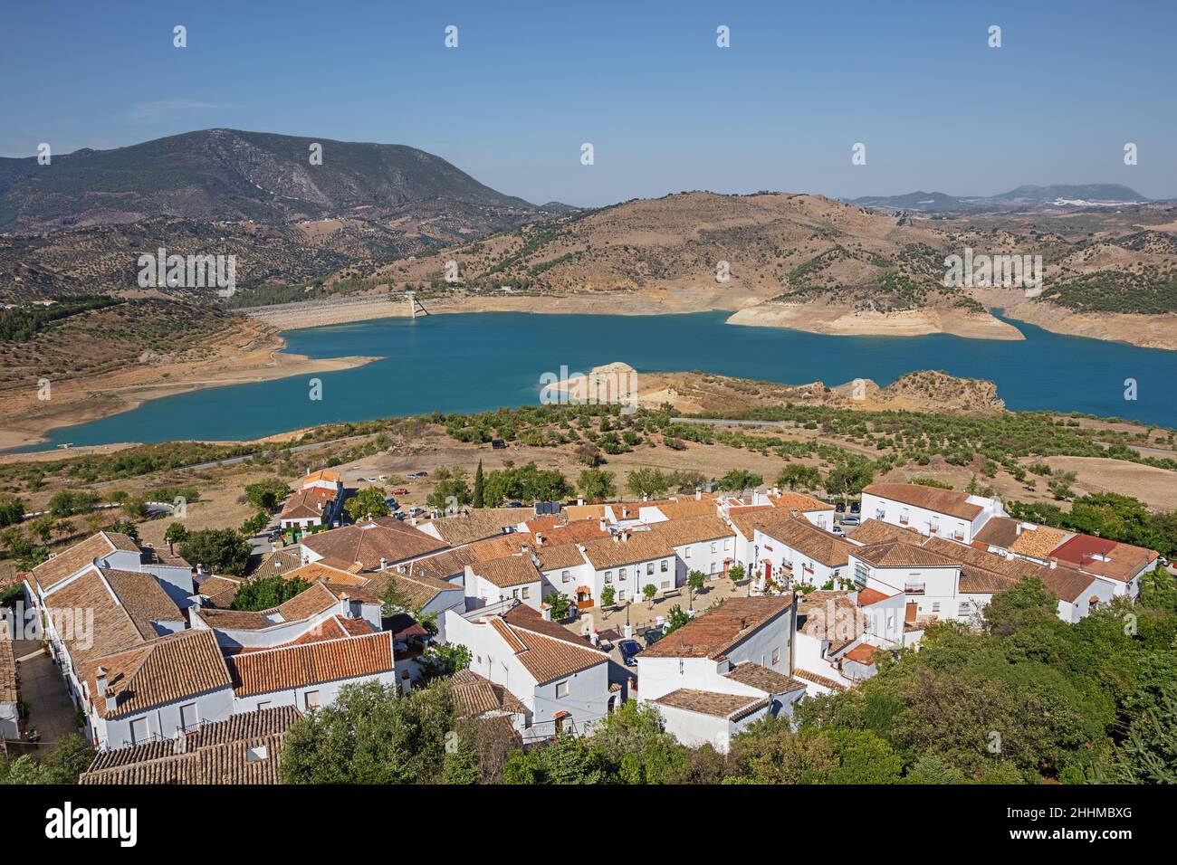 The white houses of Zahara de la Sierra with the reservoir in the ...
