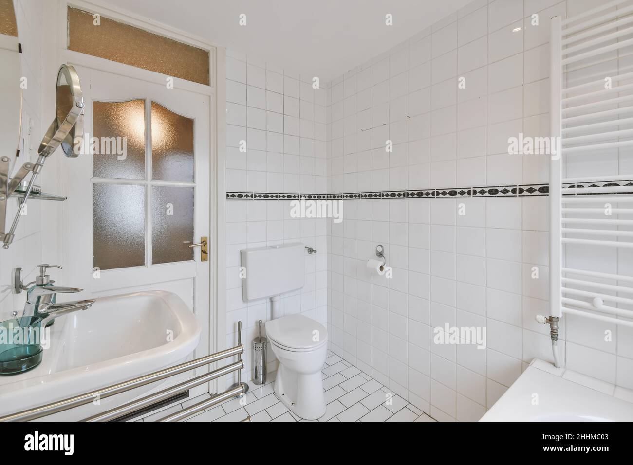 Lovely bathroom with toilet next to the door Stock Photo Alamy