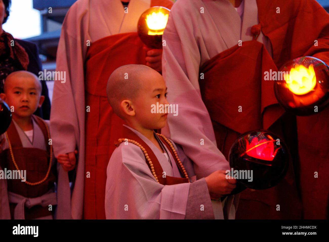 May 13, 2015 - South Korea, Seoul : Little Monks hold lanterns during a lighting ceremony to celebrate Buddha's upcoming birthday on May 25 at the Jogye Temple in Seoul, South Korea Wednesday, May 13, 2015.Nine children entered the temple to have an experience of monks' life for two weeks. (Ryu Seung-il / Polaris) Stock Photo