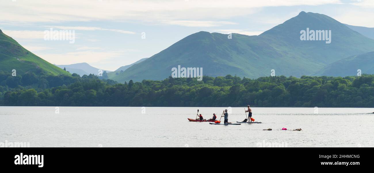 Derwentwater, Keswick, Cumbria Lake District, UK - paddleboarders and kayakers Stock Photo