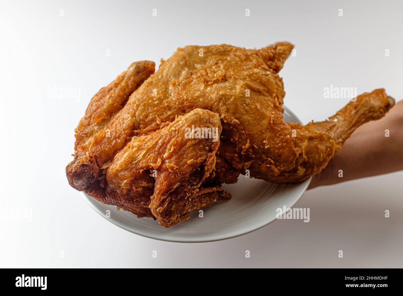 cooked whole chicken. fried food. Crispy and savory chicken dish Stock