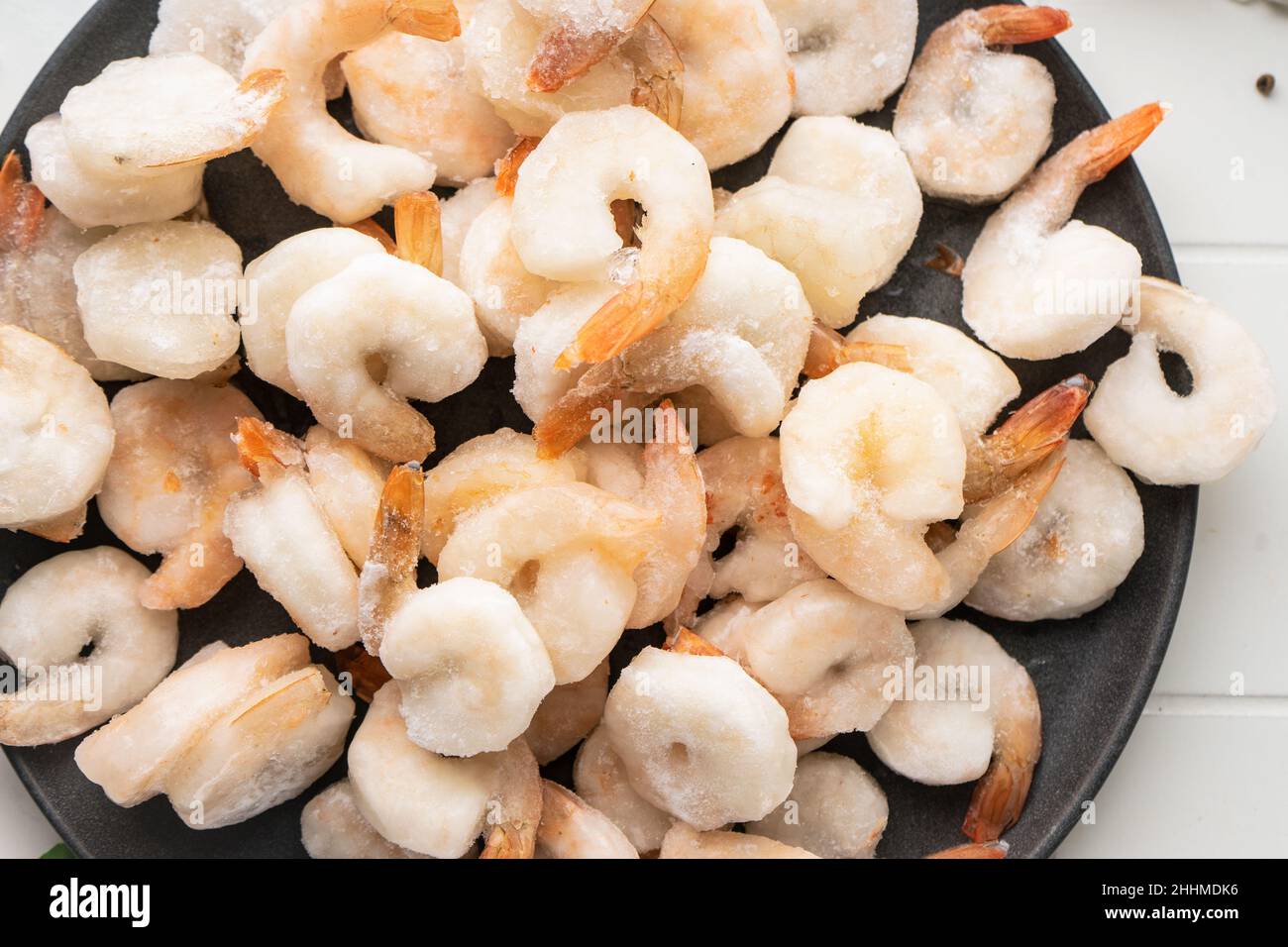 Thawed peeled shrimp, seafood, delicacy. on a white background, in a ...