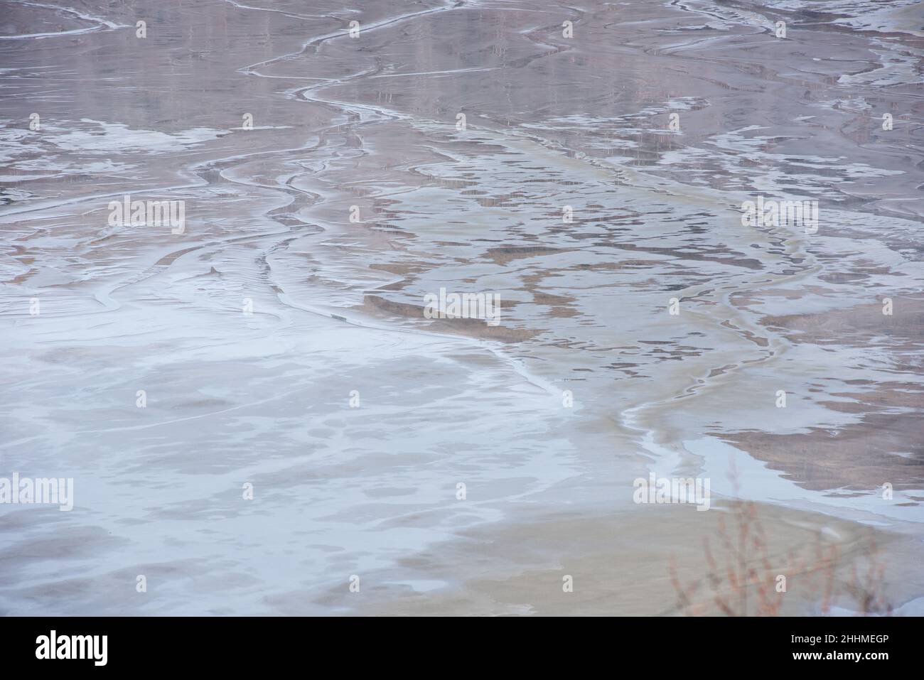Muddy waters in a decantation pond. Toxic residuals from a copper mine