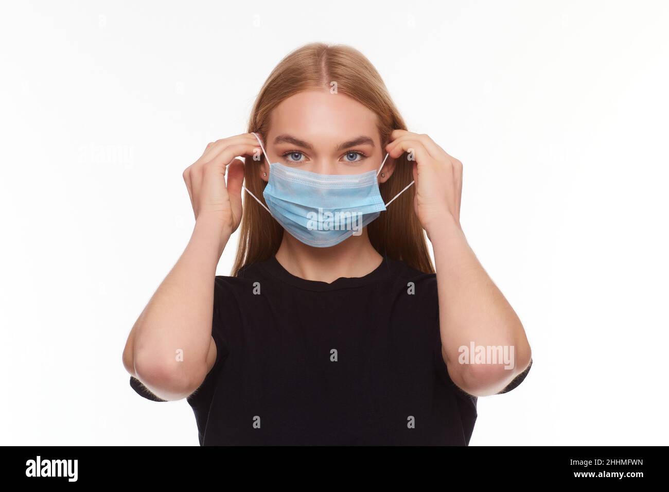Girl Puts Mask High Resolution Stock Photography and Images - Alamy