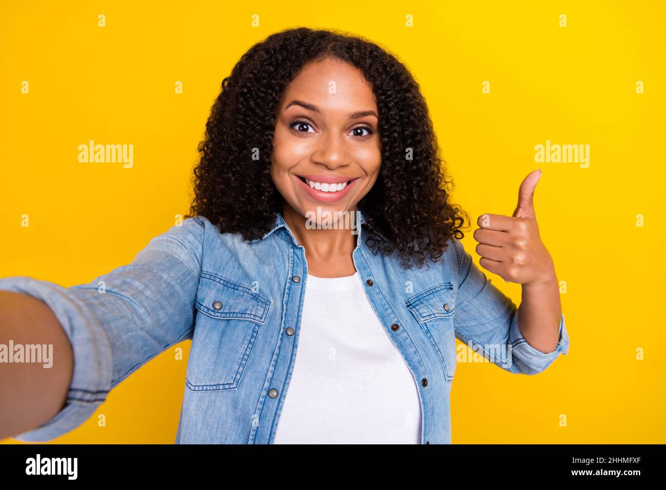 Photo of young happy dark skin woman make selfie show thumb up smile ...
