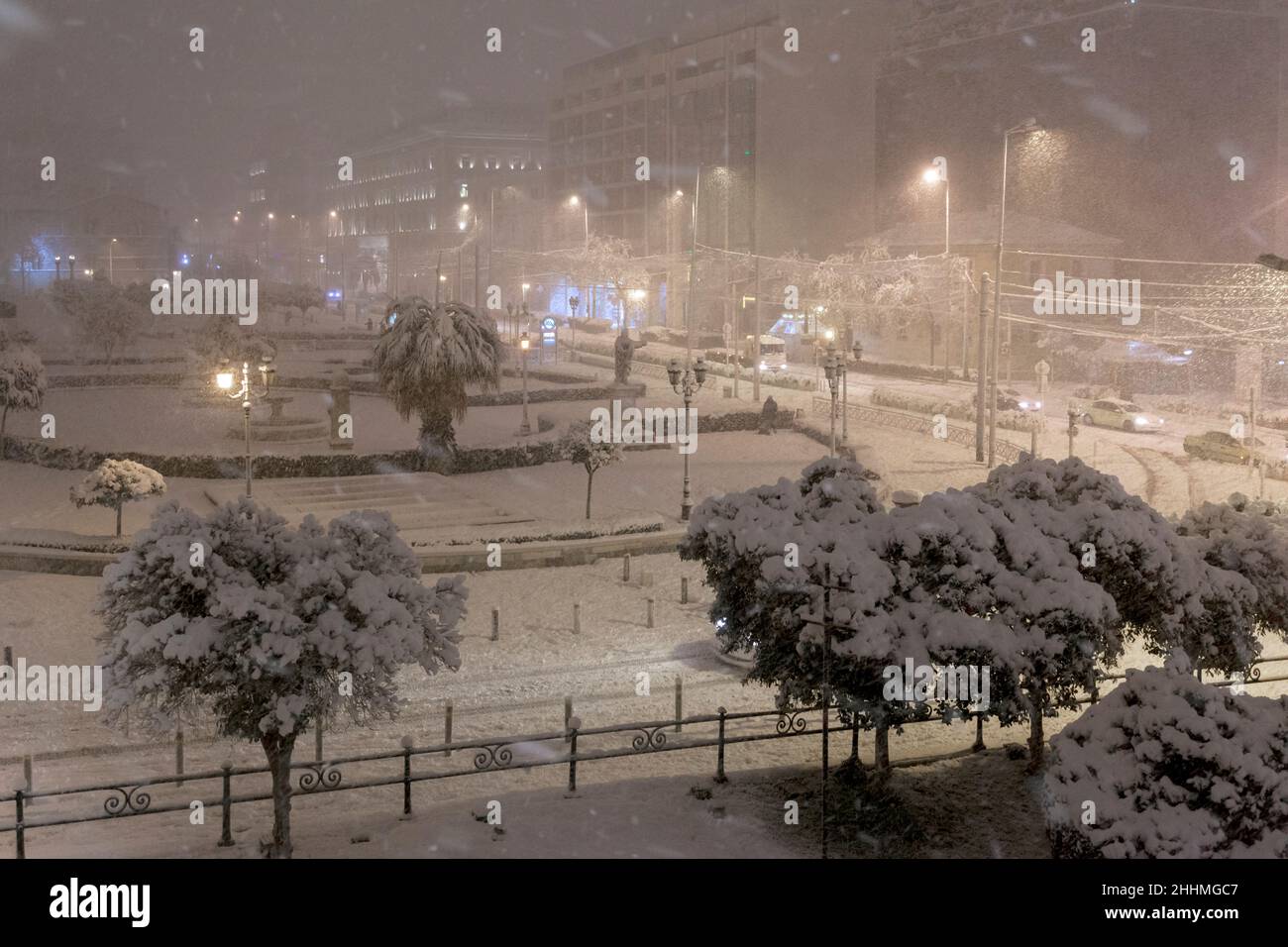 Athens, Greece, the avenue of Panepistimiou is covered in snow during heavy snowfall in January 24th 2022, creating a dreamy cityscape Stock Photo