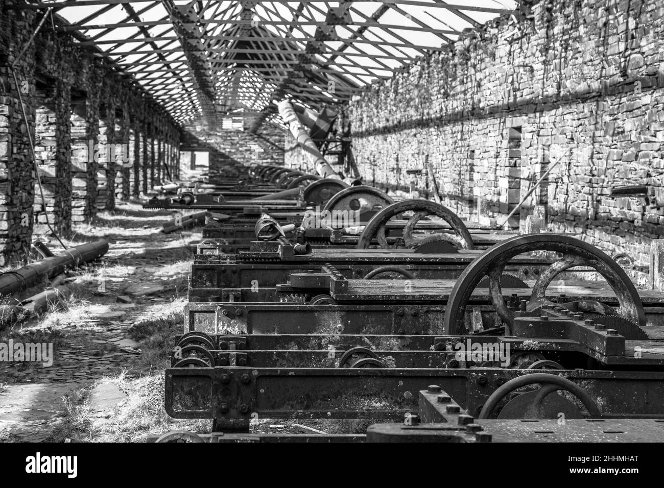 Disused slate quarry mill saw beds. Slate cutting beds, mill house, showing old machinery, now rusted & dilapidated. Dinorwig slate quarries, Snowdon. Stock Photo