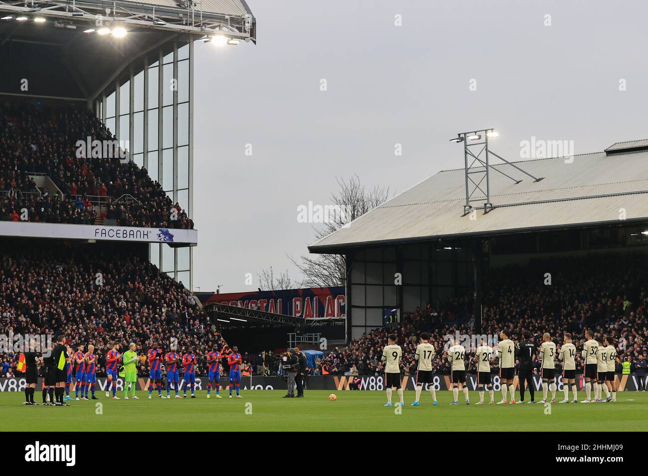 Players and officials hold a minutes applause Stock Photo