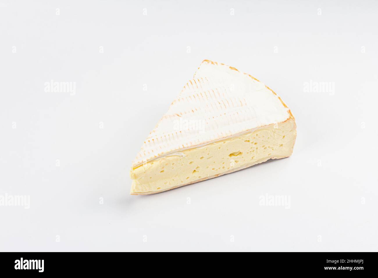 Rougette cheese isolated on white background. Soft-ripened red rind