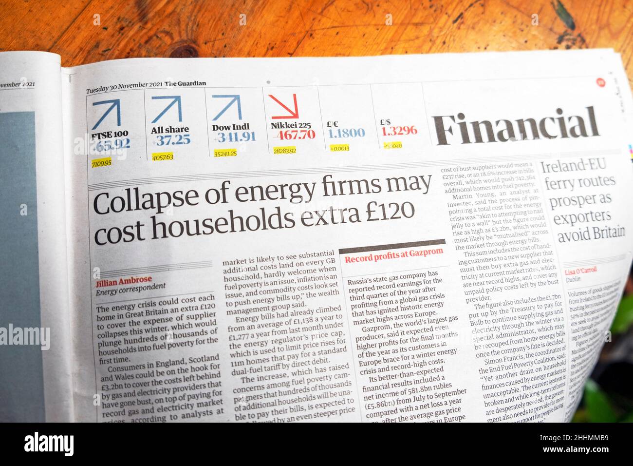 'Collapse of energy firms may cost households extra £120' Guardian newspaper headline fuel crisis clipping article 30 November 2021 London UK Britain Stock Photo