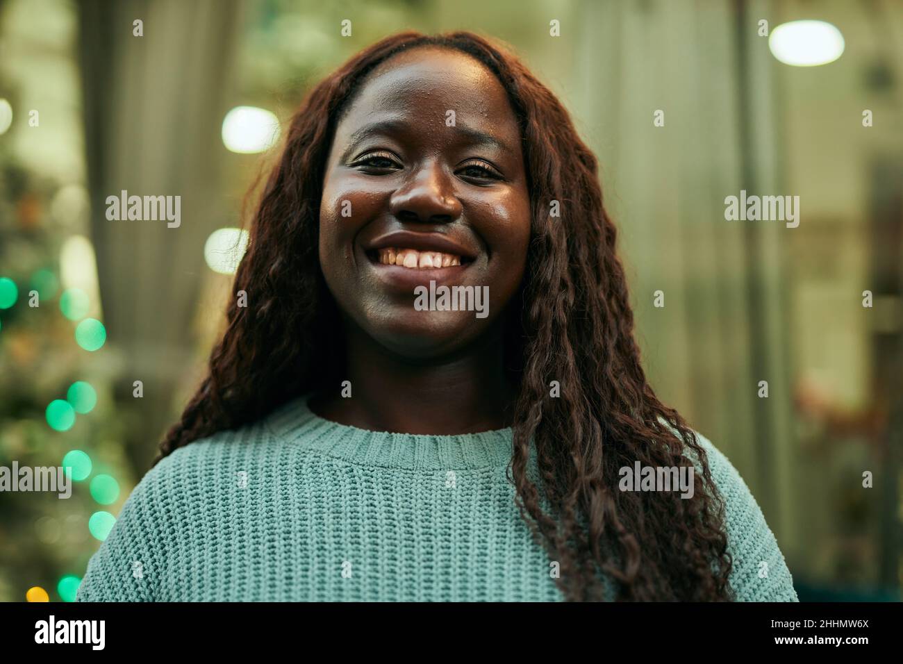 Young african woman smiling happy at the city Stock Photo - Alamy