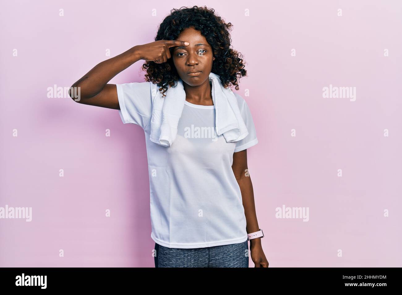 Young african american woman wearing sportswear and towel pointing unhappy  to pimple on forehead, ugly infection of blackhead. acne and skin problem  Stock Photo - Alamy