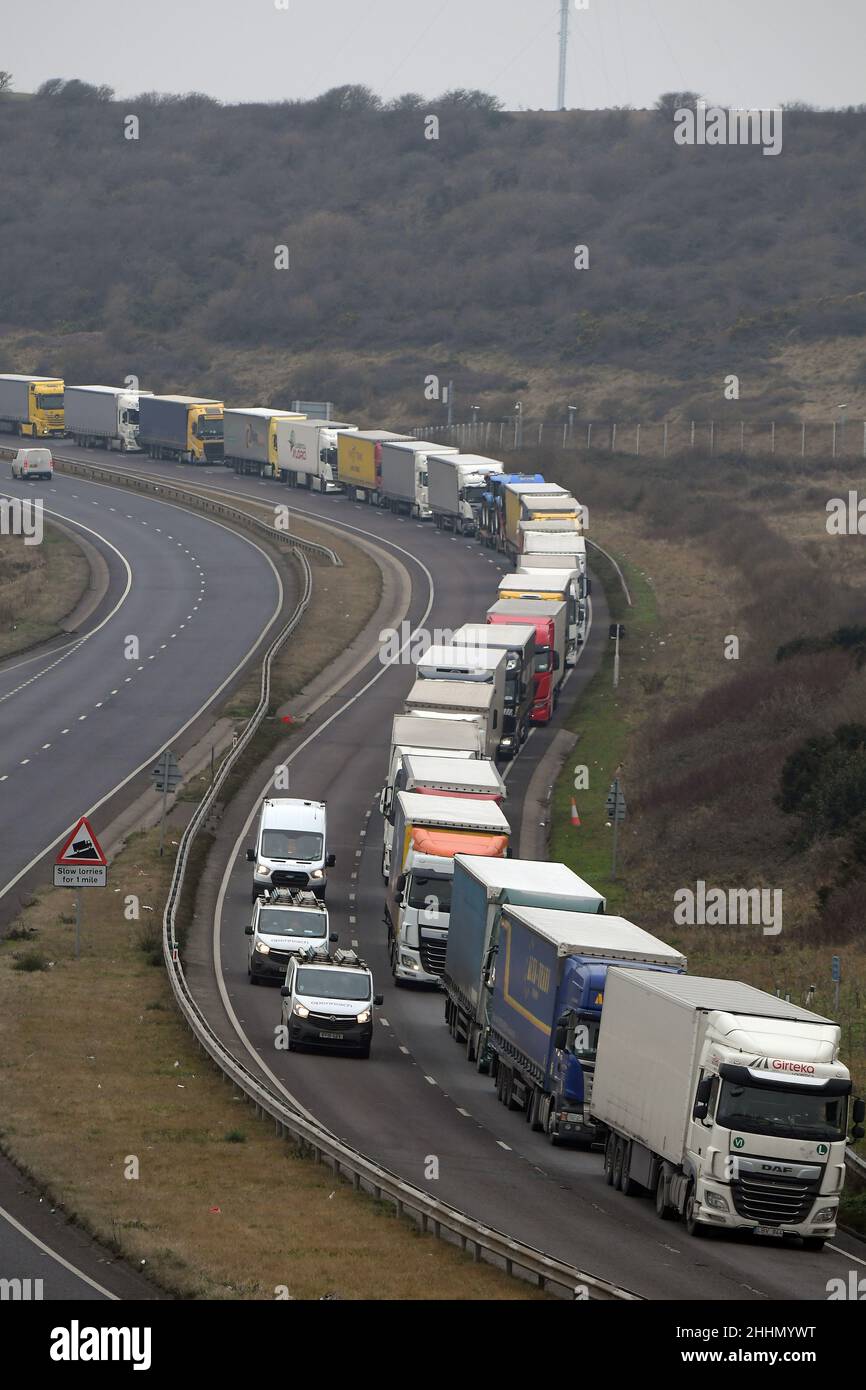 Dover Ken, UK. 25th Jan, 2022. Long queues of lorries heading to the Port of Dover. Drivers face long delays heading across the English Channel due to staff at the Port struggling with new customs forms that were introduced from the beginning of January. Drivers have complained that it's taking around 15 minutes to fill in the new Goods Vehicle Movement Service (GVMS) and other export paperwork at the Port of Dover Credit: MARTIN DALTON/Alamy Live News Stock Photo