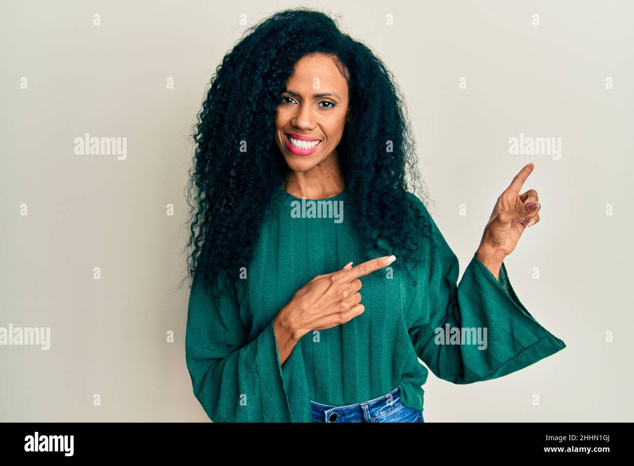 Middle age african american woman wearing casual clothes smiling and ...