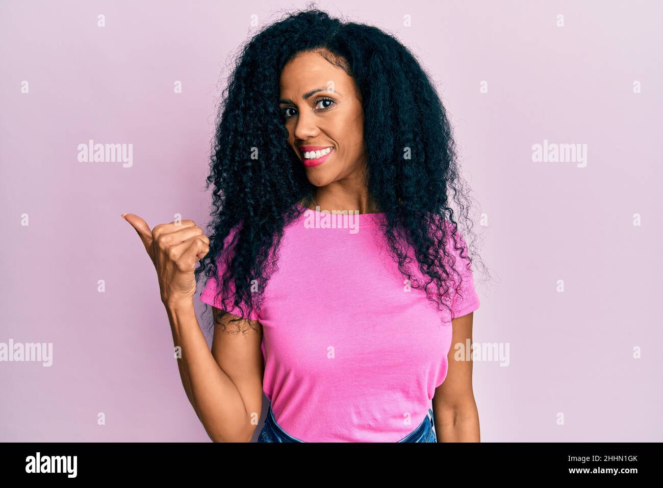Middle age african american woman wearing casual clothes smiling with ...