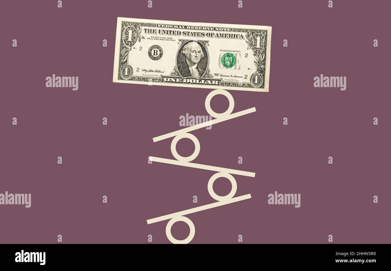 One US dollar bill balancing on percentage signs. Interest rate concept illustration. Stock Photo