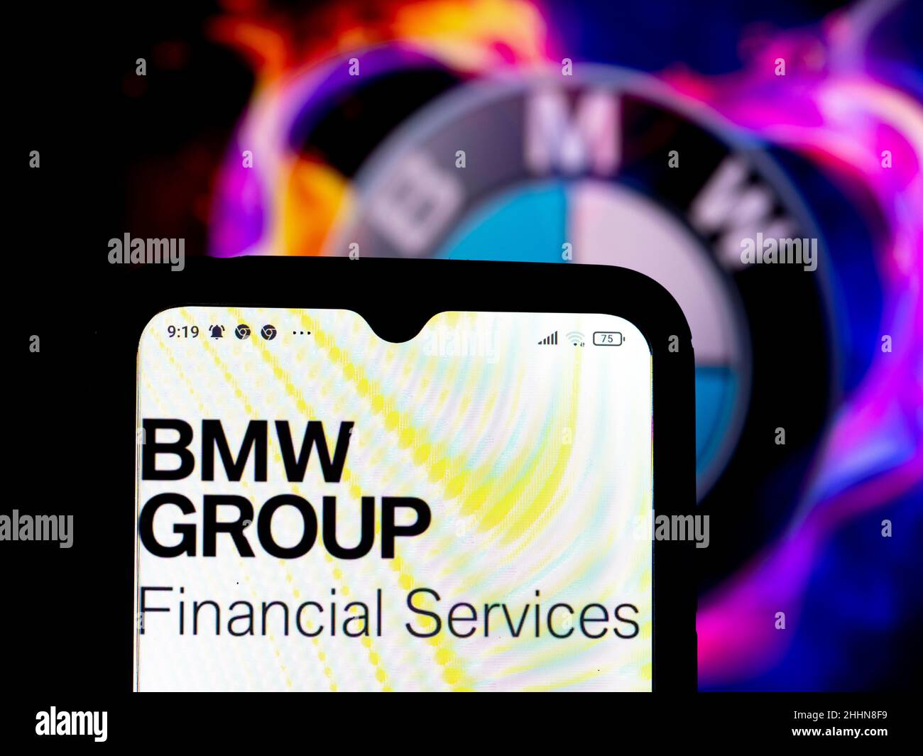 In this photo illustration, the BMW Group Financial Services logo is